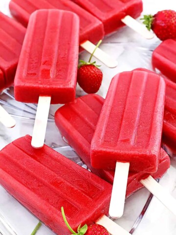 If you love popsicles, I have the perfect recipe for you! These homemade Strawberries Popsicles are naturally sweet, free of any refined sugar, and loaded with a delicious fresh strawberry flavor in each bite!