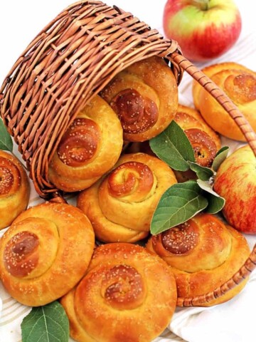 Ah, the sweet flavors of fall! These super-soft, Sweet Swirl Apple Buns are a wonderful comfort fall treat. The juicy grated apples make them incredibly moist, delicious, and irresistible! They look so beautiful and glossy after being brushed with the egg glaze and sprinkled with organic raw sugar. You just wanna eat them raw, like cookie dough! ;)