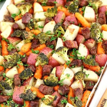 This Roasted Beef is the most delicious combination of marinated pieces of beef that are then roasted in the oven, along with some delicious veggies as a bonus, for the perfect dinner meal that's to die for! 