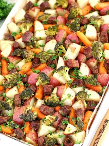 This Roasted Beef is the most delicious combination of marinated pieces of beef that are then roasted in the oven, along with some delicious veggies as a bonus, for the perfect dinner meal that's to die for! 