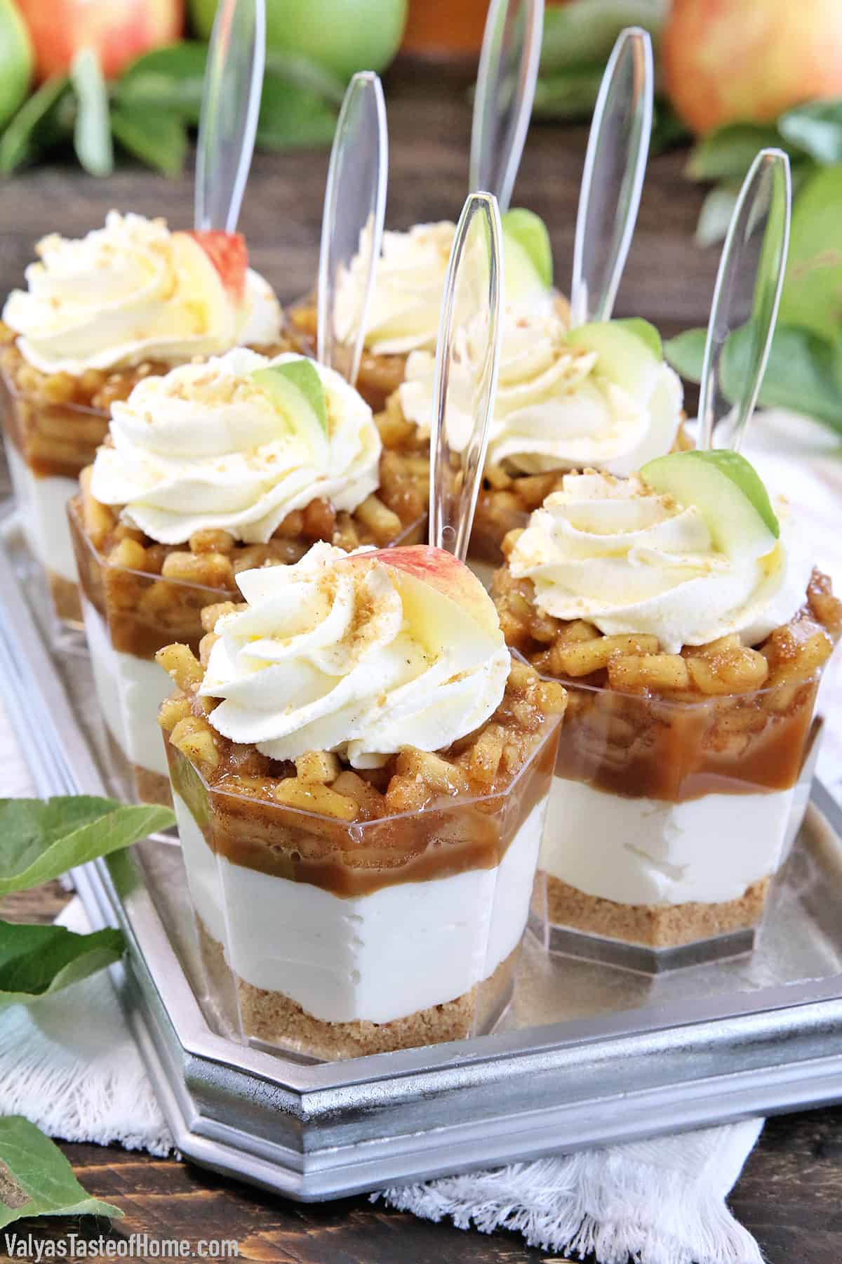 These No-Bake Caramel Apple Pie Cheesecake Parfaits are out of this world delicious! Layers of goodness: crushed buttery graham cracker crust, smooth and creamy cheesecake filling, tasty and rich organic caramel, slathered with fantastic homemade diced apple pie filling, and finally topped with whipped cream.