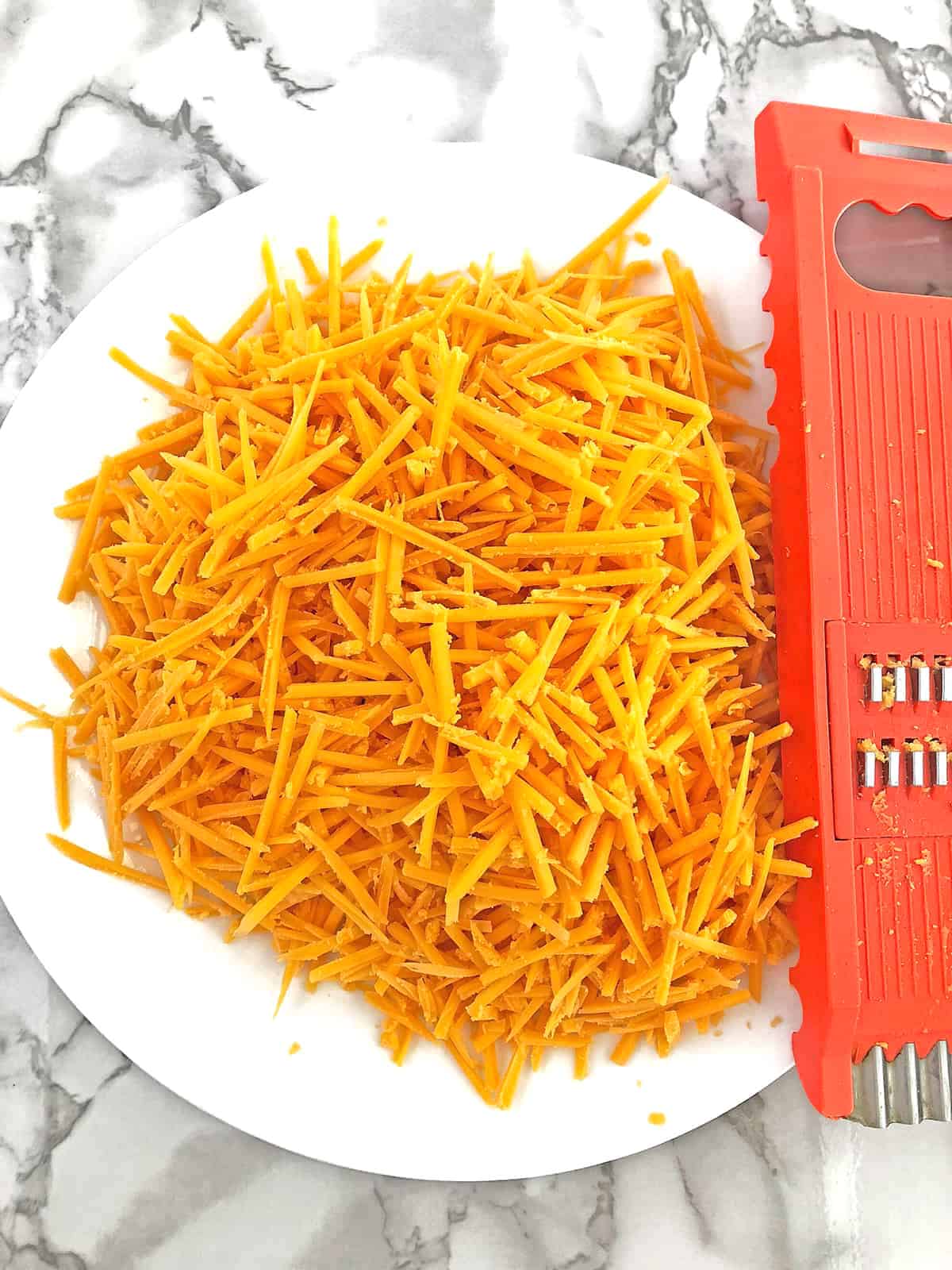 While the above ingredients are cooling down, shred the cheese.