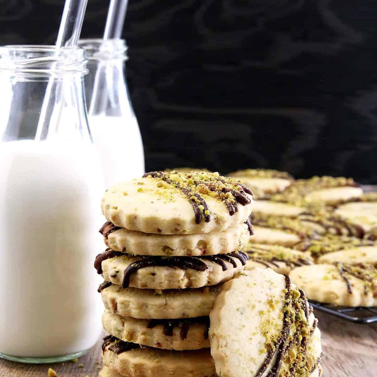 Move over chocolate chip cookies, these delicious cookies may just become a new favorite. What goes great with a treat like these Easy Pistachio Dark Chocolate Drizzle Shortbread Cookies? You're right, cold milk!