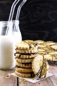 Move over chocolate chip cookies, these delicious cookies may just become a new favorite. What goes great with a treat like these Easy Pistachio Dark Chocolate Drizzle Shortbread Cookies? You're right, cold milk!