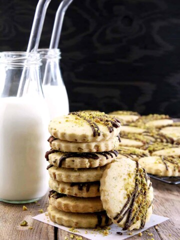 Move over chocolate chip cookies, these delicious cookies may just become a new favorite. What goes great with a treat like these Easy Pistachio Dark Chocolate Drizzle Shortbread Cookies? You're right, cold milk!