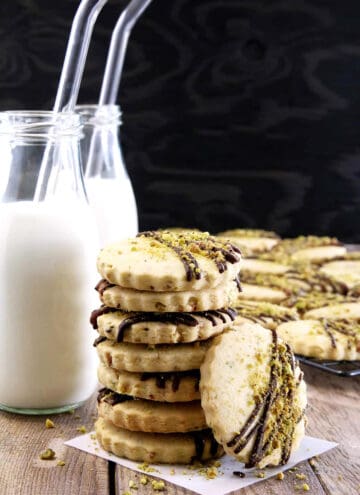 Easy Pistachio Dark Chocolate Drizzle Shortbread Cookies 1 Move over chocolate chip cookies, these delicious cookies may just become a new favorite. What goes great with a treat like these Easy Pistachio Dark Chocolate Drizzle Shortbread Cookies? You're right, cold milk!