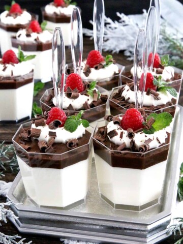 An amazingly delicious creamy mousse-like base, covered with a thin layer of cacao-jelly, topped with smooth whipping cream, and dressed with berries and shaved dark chocolate.