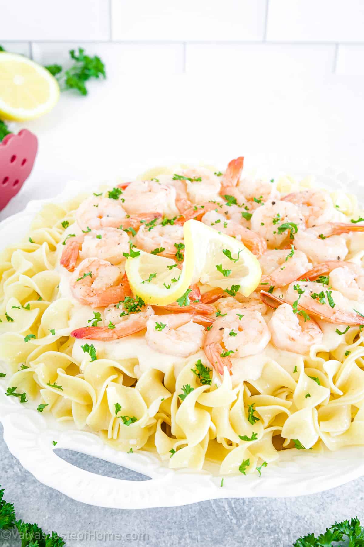 This Shrimp Alfredo Pasta features large shrimp cooked to perfection are covered in a velvety sauce flavored with butter, lemon, and a touch of seasoning. 