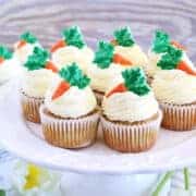 These The Best Carrot Cake Cupcakes are moist, fluffy, and spongy soft, delicious cupcakes you'll ever try. They are made completely from scratch, down to the freshly grated carrots, and topped with a generous swirl of the absolute best cream cheese frosting!