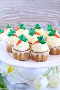 These The Best Carrot Cake Cupcakes are moist, fluffy, and spongy soft, delicious cupcakes you'll ever try. They are made completely from scratch, down to the freshly grated carrots, and topped with a generous swirl of the absolute best cream cheese frosting!