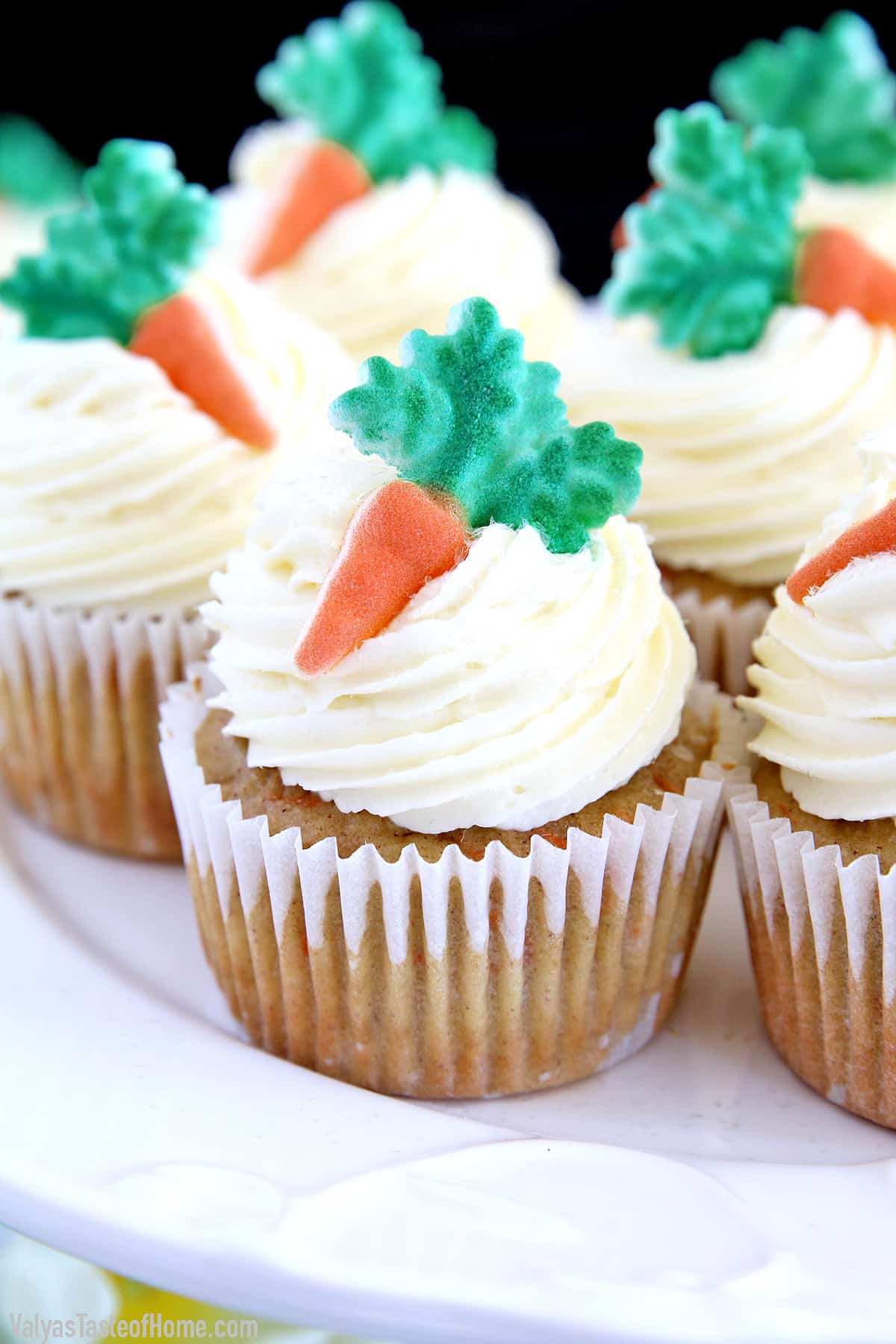 These The Best Carrot Cake Cupcakes are moist, fluffy, and spongy soft, delicious cupcakes you'll ever try. They are made completely from scratch, down to the freshly grated carrots, and topped with a generous swirl of the absolute best cream cheese frosting!
