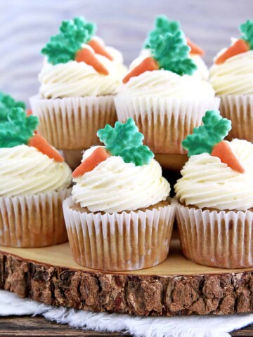 These The Best Carrot Cake Cupcakes are moist, fluffy, and spongy soft, delicious cupcakes you'll ever try. They are made completely from scratch, down to the freshly grated carrots, and topped with a generous swirl of the absolute best cream cheese frosting!