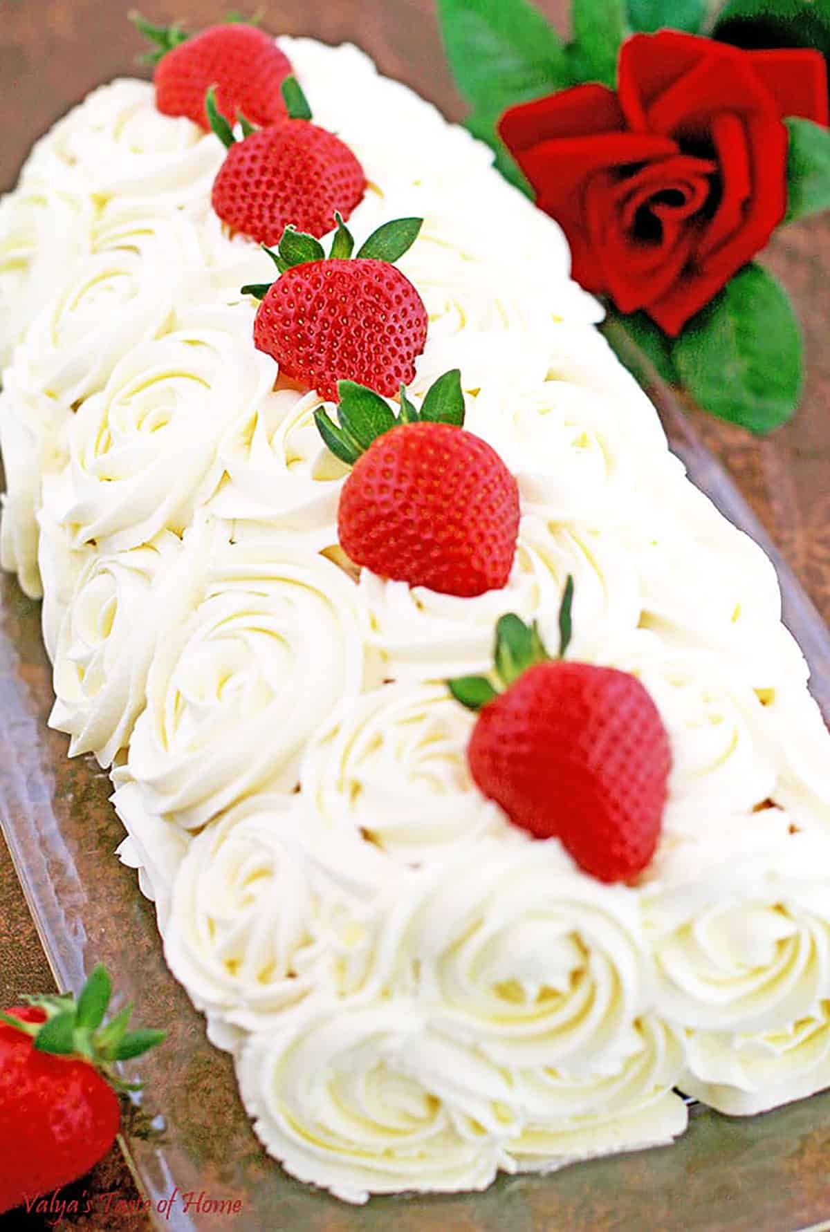 This Strawberry Roll Cake recipe is not only easy to make, but it also looks absolutely stunning. This Roll Cake is a spongy, fluffy cake filled with an incredibly delicious cream frosting and strawberries that will have you wanting more!