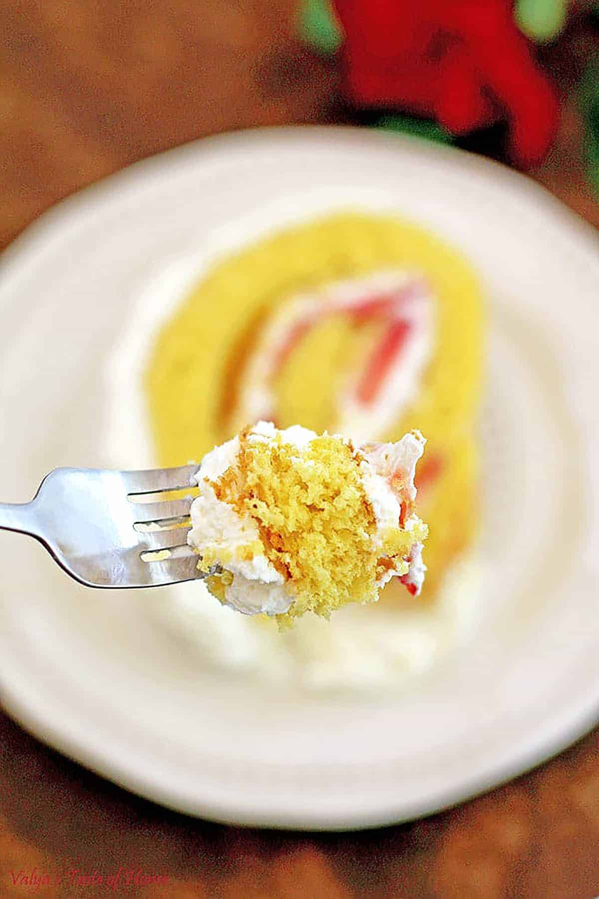 If you try to cut this cake with a dull knife, the cream may leak out the sides. Make sure your knife is warm and sharpened so it can easily cut through the layers of roll cake.