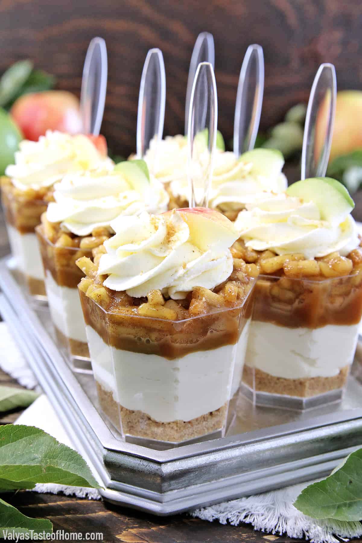 These No Bake Caramel Apple Pie Cheesecake Parfaits are out of this world delicious! Layers of goodness: crushed buttery graham cracker crust, smooth and creamy cheesecake filling, tasty and rich organic caramel, slathered with fantastic homemade diced apple pie filling, and finally topped with whipped cream.