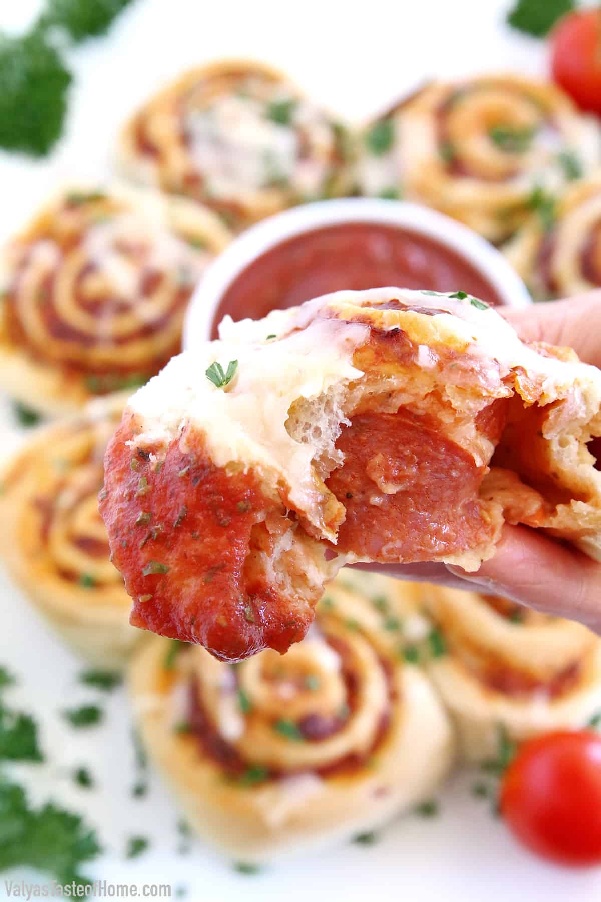 Move over, tiny pizza bites, because here come hearty Easy Pepperoni Pizza Rolls! This recipe is made with my popular super soft and chewy Homemade Pizza Dough, Homemade Pizza Sauce, loads of scrumptious turkey pepperoni, and mozzarella cheese. All rolled up into one amazingly tasty treat that is always a big hit at my house.