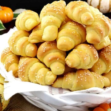 These super easy Pumpkin Dinner Rolls are made with pumpkin puree for the perfect pumpkin flavor and the tastiest side dish on your Thanksgiving dinner table!