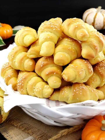 These super easy Pumpkin Dinner Rolls are made with pumpkin puree for the perfect pumpkin flavor and the tastiest side dish on your Thanksgiving dinner table!