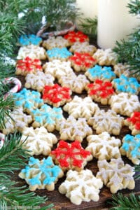 Christmas Snowflake Spritz Cookies are some of the easiest cookies to make and are widely loved by most people. They are crisp, buttery, and delicious cookies that are made using an easy cookie press. And the result is so gorgeous and festive!