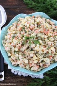 This Classic Potato Salad Recipe (Olivie) is a must-have on any holiday table. It's very easy to make, very hearty, and craveable. Just cook some veggies and eggs, chop them up, add mayo, salt, and pepper and you have a very delicious salad.