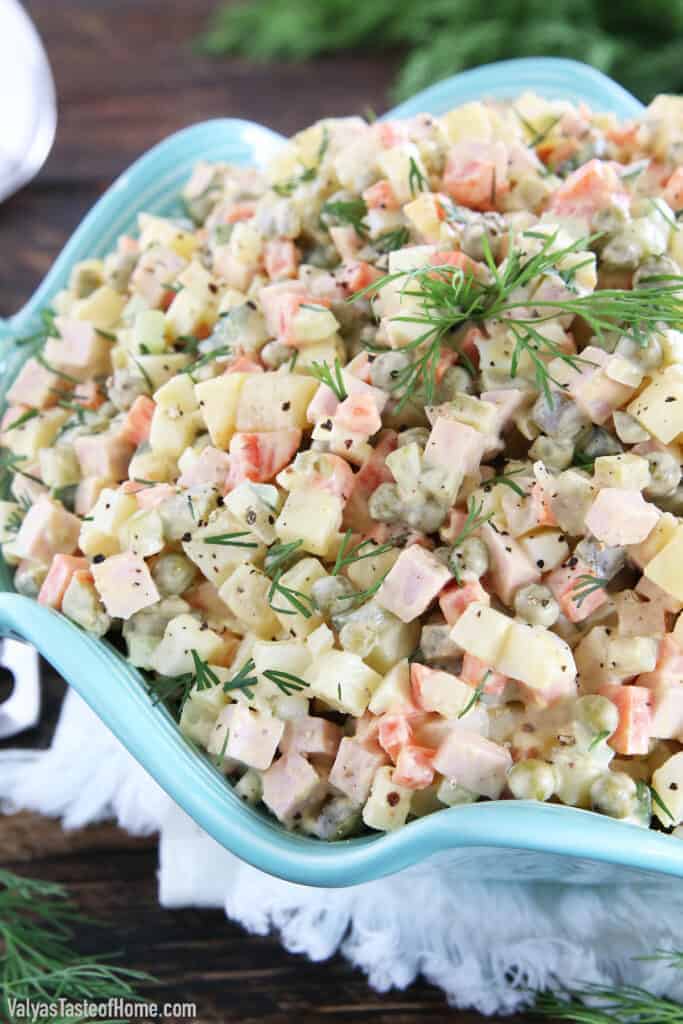 This Classic Potato Salad Recipe (Olivie) is a must-have on any holiday table. It's very easy to make, very hearty, and craveable. Just cook some veggies and eggs, chop them up, add mayo, salt, and pepper and you have a very delicious salad.