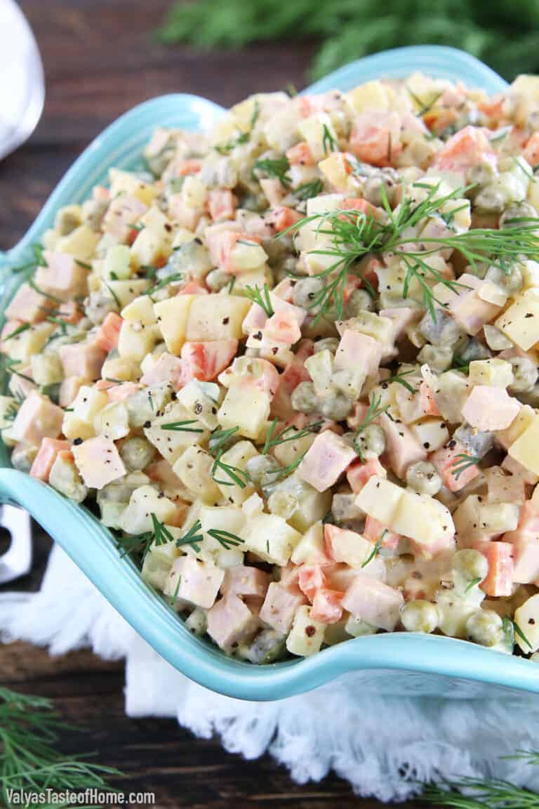 This Classic Potato Salad Recipe (Olivie) is a must-have on any holiday table. It's very easy to make, very hearty, and craveable. Just cook some veggies and eggs, chop them up, add mayo, salt, and pepper and you have a very delicious salad.