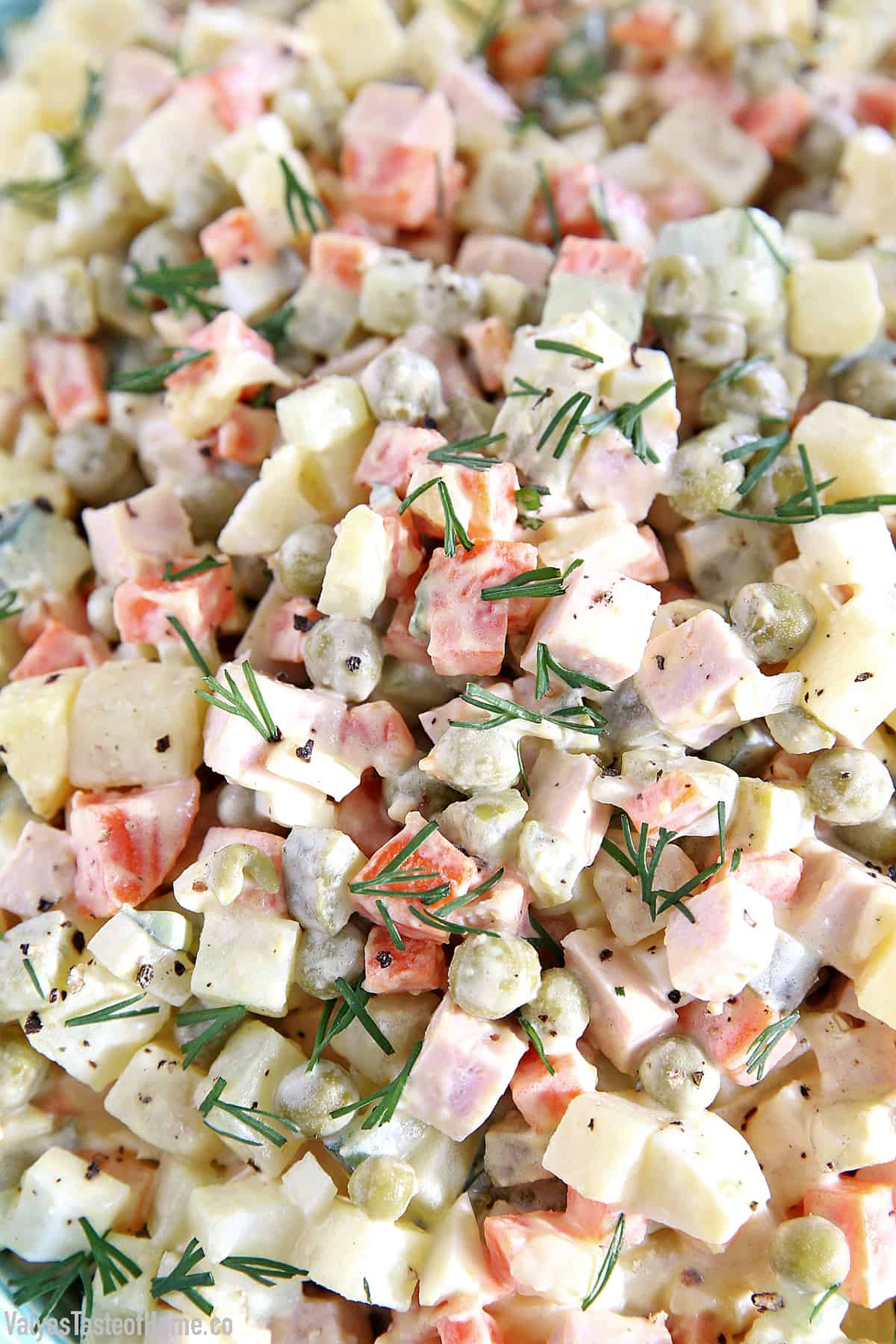This Classic Potato Salad Recipe (Olivie) is a must-have on any holiday table. It's very easy to make, very hearty, and craveable. Just cook some veggies and eggs, chop them up, add mayo, salt, and pepper and you have a very delicious salad.