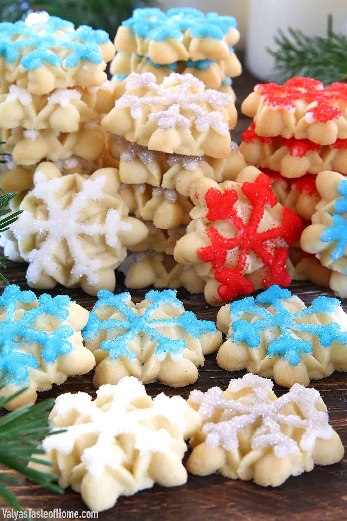 Snowflake Cookies are delicious homemade butter cookies that are then shaped into snowflakes and decorated with edible colored sugar for the most beautiful festive cookies you’ve ever seen!
