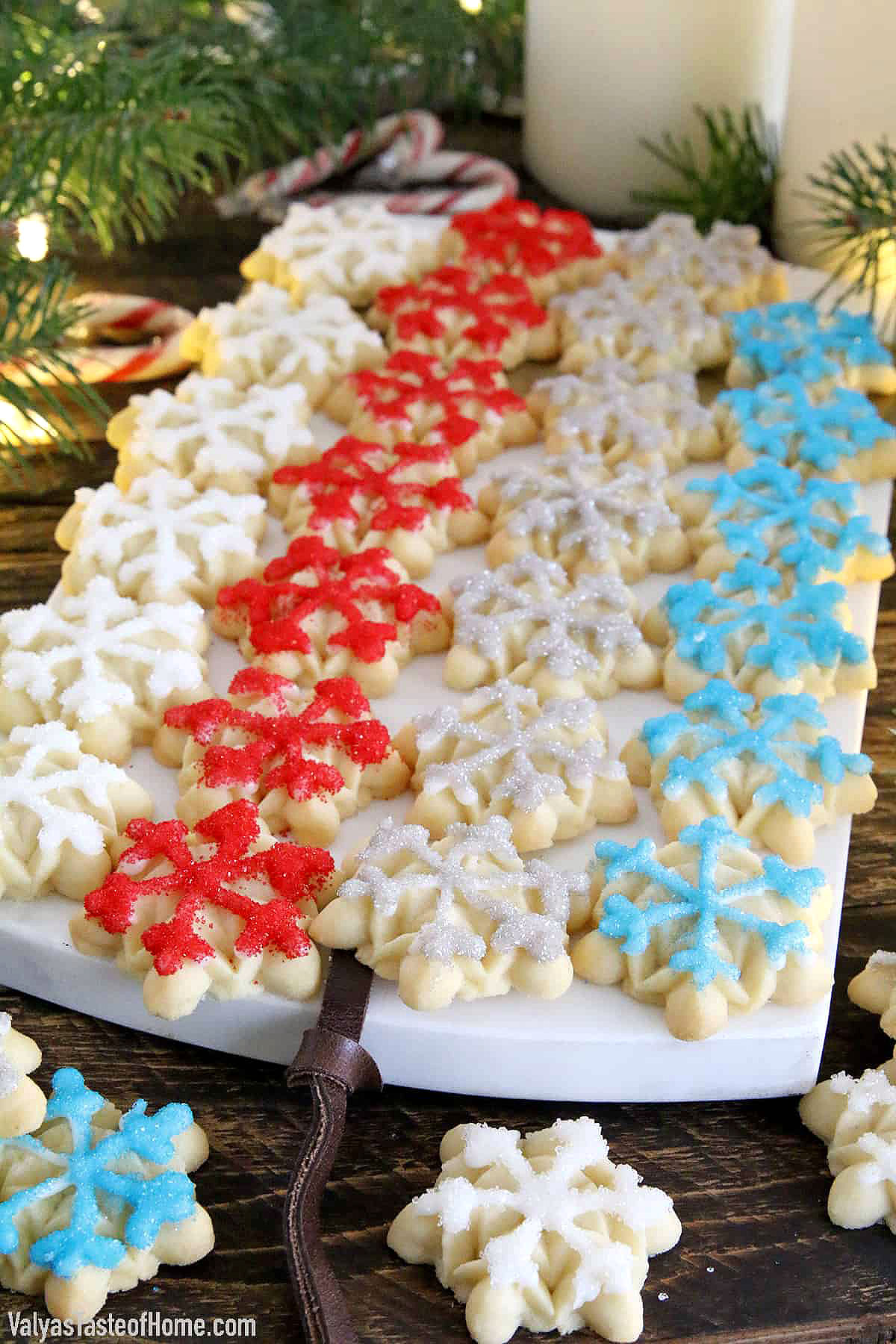 These Snowflake Cookies are crisp, buttery, and delicious cookies that are made using an easy cookie press giving you a stunningly festive result.