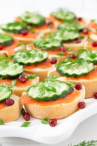 Smoked Salmon Canapes are exactly what they sound like: delicious bite-sized savory appetizers that are topped with smoked salmon, cream cheese, dill, and other toppings to take it to the next level.