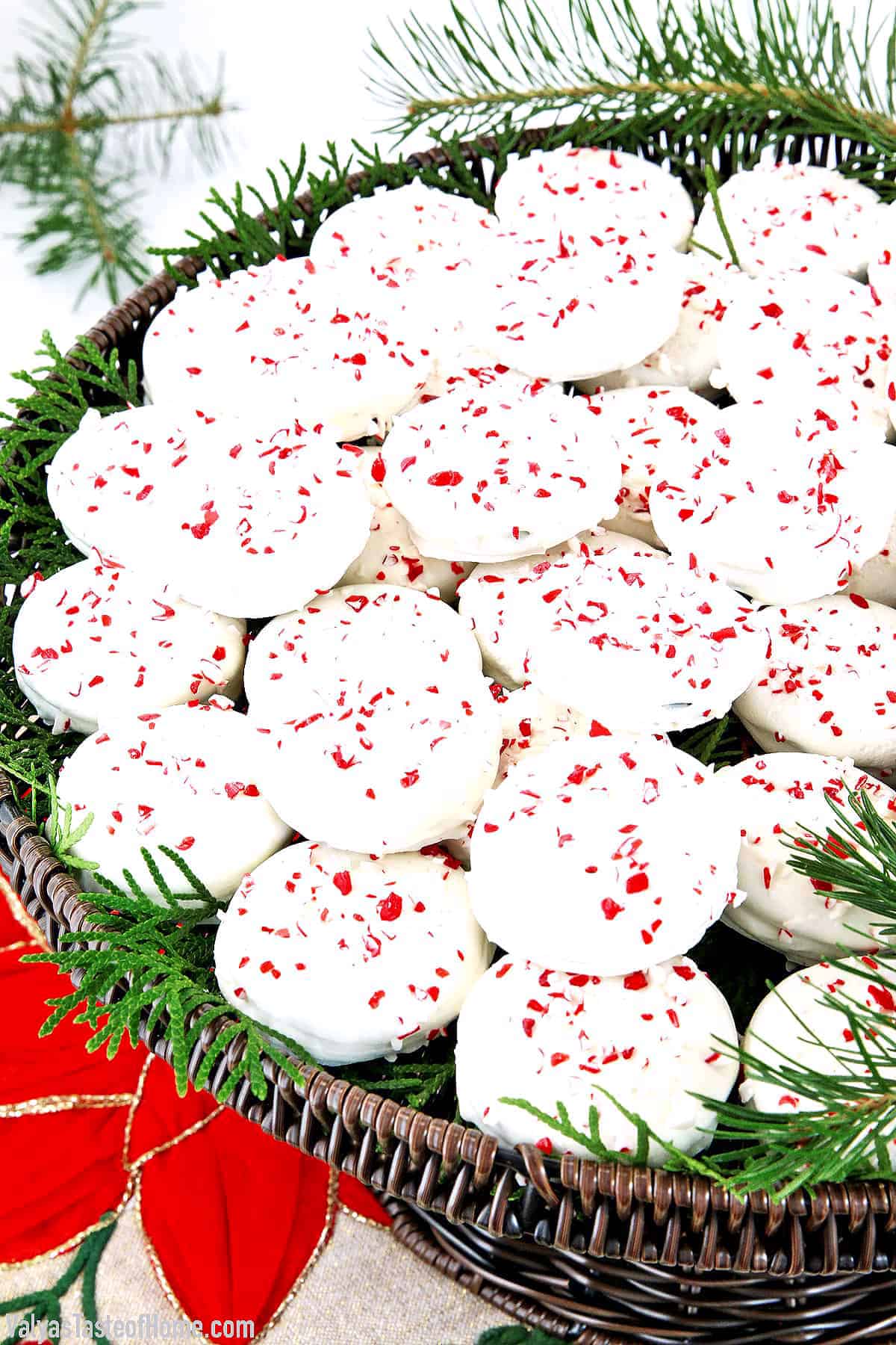 Peppermint Oreos are delicious chocolate crème cookie sandwiches coated with melted white chocolate and sprinkled with crushed candy cane!