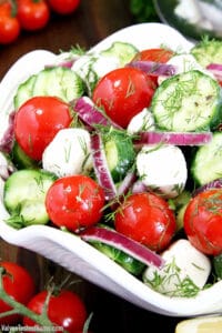 This Tomato and Mozzarella Salad is fresh and light with classic flavors! It's super easy to make at home and turns out great every single time.