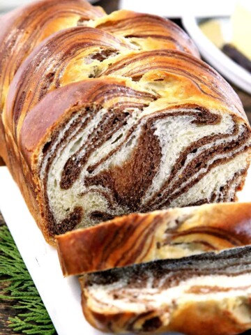 This Easy Soft and Fluffy Sweet Marbled Bread Recipe feature alluring swirls of vanilla and chocolate. Although it may look dizzyingly complicated it is actually super easy to make.