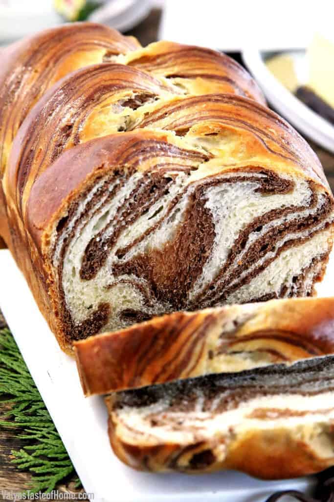 This Easy Soft and Fluffy Sweet Marbled Bread Recipe feature alluring swirls of vanilla and chocolate. Although it may look dizzyingly complicated it is actually super easy to make.
