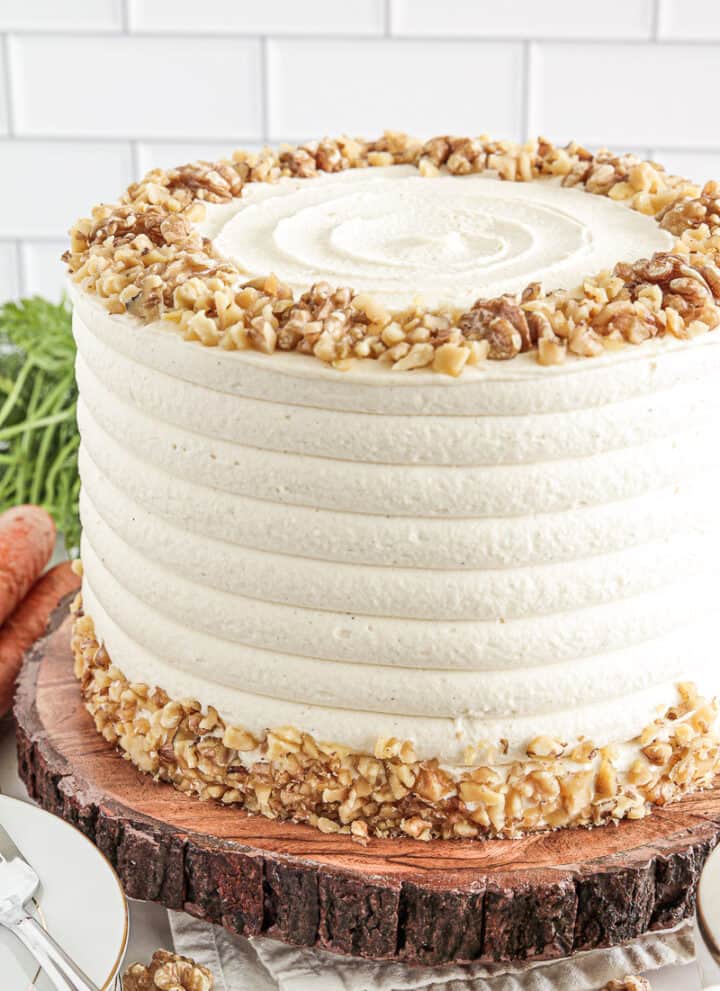The name Simple Carrot Walnut Cake Recipe says it all! Incredibly moist, super fluffy, warming spices, loads of carrots, and no oil, makes this cake absolutely irresistible!