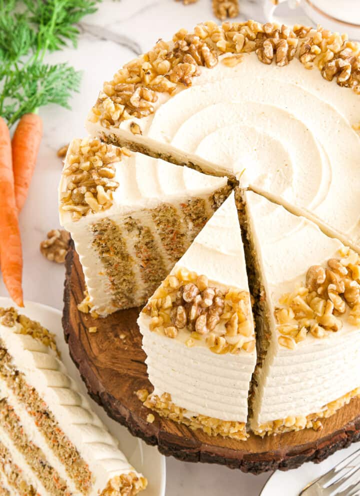 The cake layers are incredibly moist, not as high in calories as your store-bought cake, and super fluffy, with warming spices, loads of carrots, and no vegetable oil used making this cake absolutely irresistible!