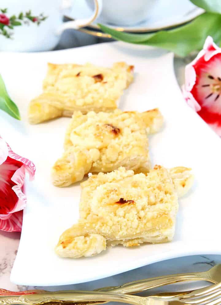 These Cream Cheese Puff Pastries recipe will give you the perfect cream cheese Danishes that are layers upon layers of crisp, flaky, buttery pastry topped with delicious vanilla cream cheese filling and sprinkled with sugary crumb goodness!