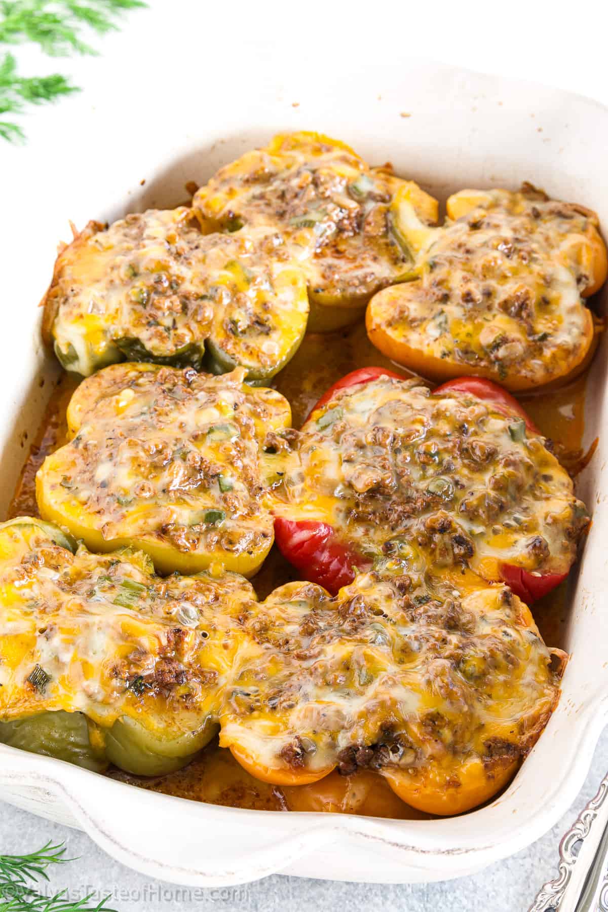 These Stuffed Bell Peppers are filled with a delicious mixture of ground beef, mushrooms, tomato sauce, topped with cheese, and then baked for the perfect meal!