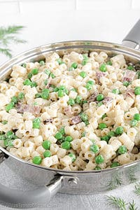 This creamy pasta with bacon and peas is the perfect weeknight meal and can be made in under 30 minutes! Plus, kids absolutely love the flavor!
