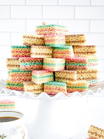 A waffle cake is a type of dessert made by layering colorful wafer cookies with sweetened condensed milk and letting it sit under a press or weight to soften and compress the layers.