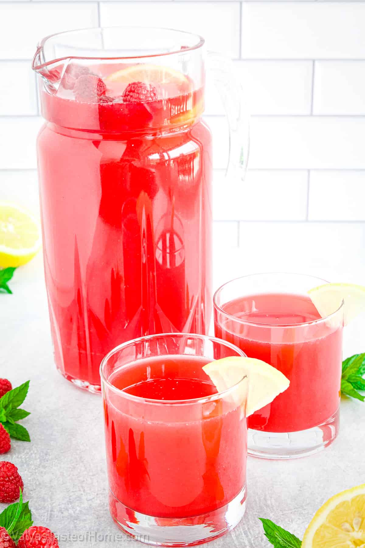This fresh Raspberry Lemonade is the best way to enjoy the summer featuring the perfect balance of acidic lemons and juicy raspberries that taste delicious!
