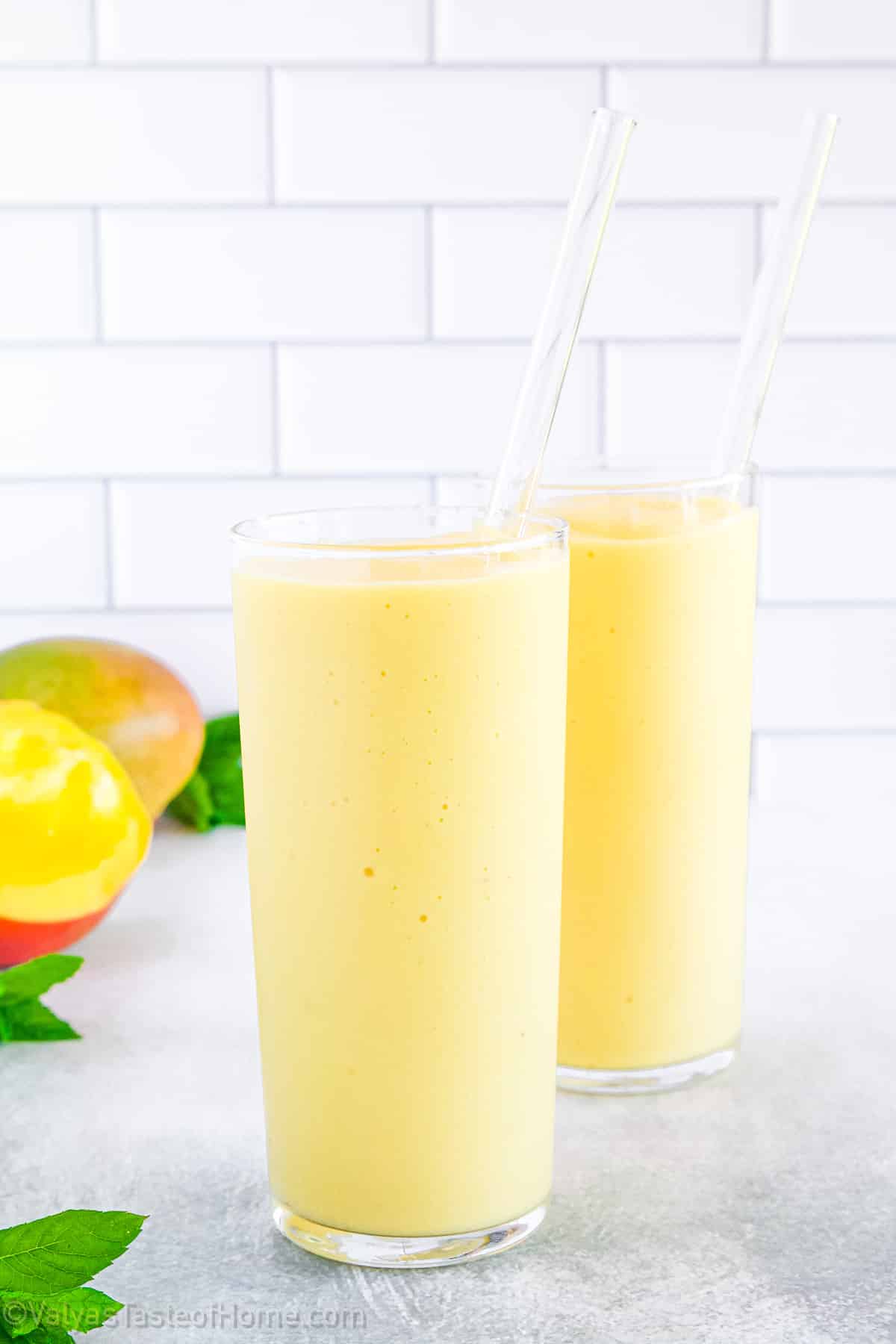 This Tropical Smoothie features the most delicious blend of tropical fruits, from mango chunks, bananas, to pineapple chunks, with some coconut milk for the tastiest smoothie you’ve had all year!