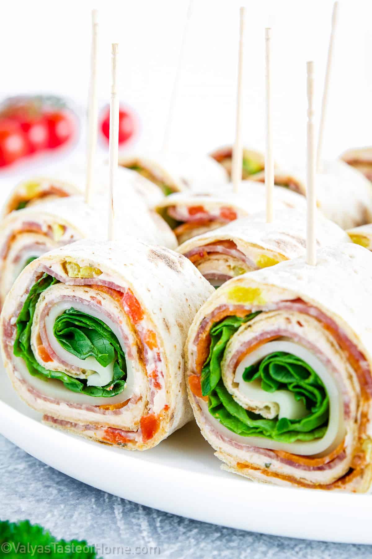 Italian pinwheels are a delicious appetizer made with tortilla, cheese, and various fillings such as roasted red peppers, salami, pepperonis, and cheese.