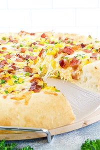 What makes this dish unique and delicious is the combination of classic pizza ingredients with breakfast flavors and textures.