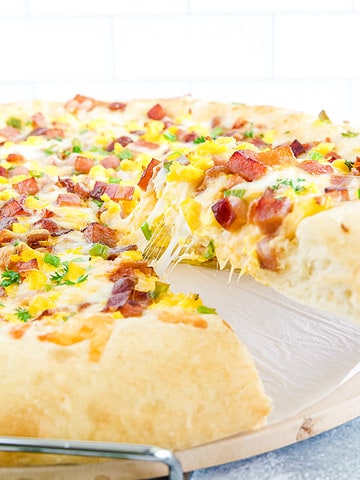 What makes this dish unique and delicious is the combination of classic pizza ingredients with breakfast flavors and textures.