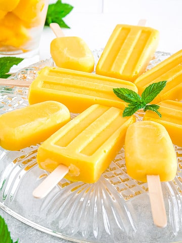 Made with ripe mangoes, creamy coconut milk, coconut water, and a touch of maple syrup these popsicles are not only incredibly easy to make, but they also boast a vibrant yellow color that is sure to brighten up any dessert table. 