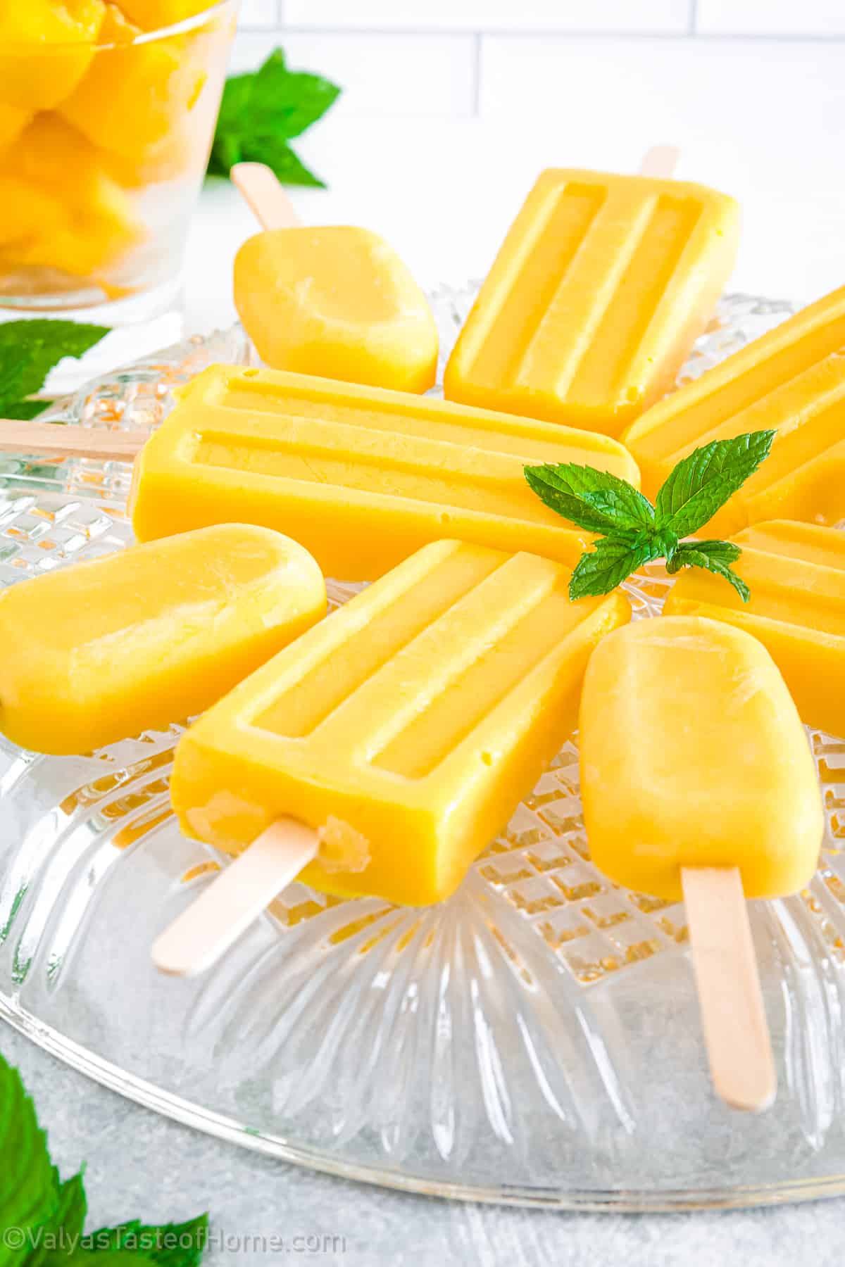 Made with ripe mangoes, creamy coconut milk, coconut water, and a touch of maple syrup these popsicles are not only incredibly easy to make, but they also boast a vibrant yellow color that is sure to brighten up any dessert table. 