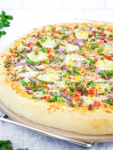 Cheeseburger Pizza is an absolutely delicious fusion of two beloved classics - cheeseburger and pizza.