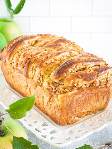 Apple fritter bread is a delicious sweet bread that is made with diced apples, cinnamon, and a sweet glaze.