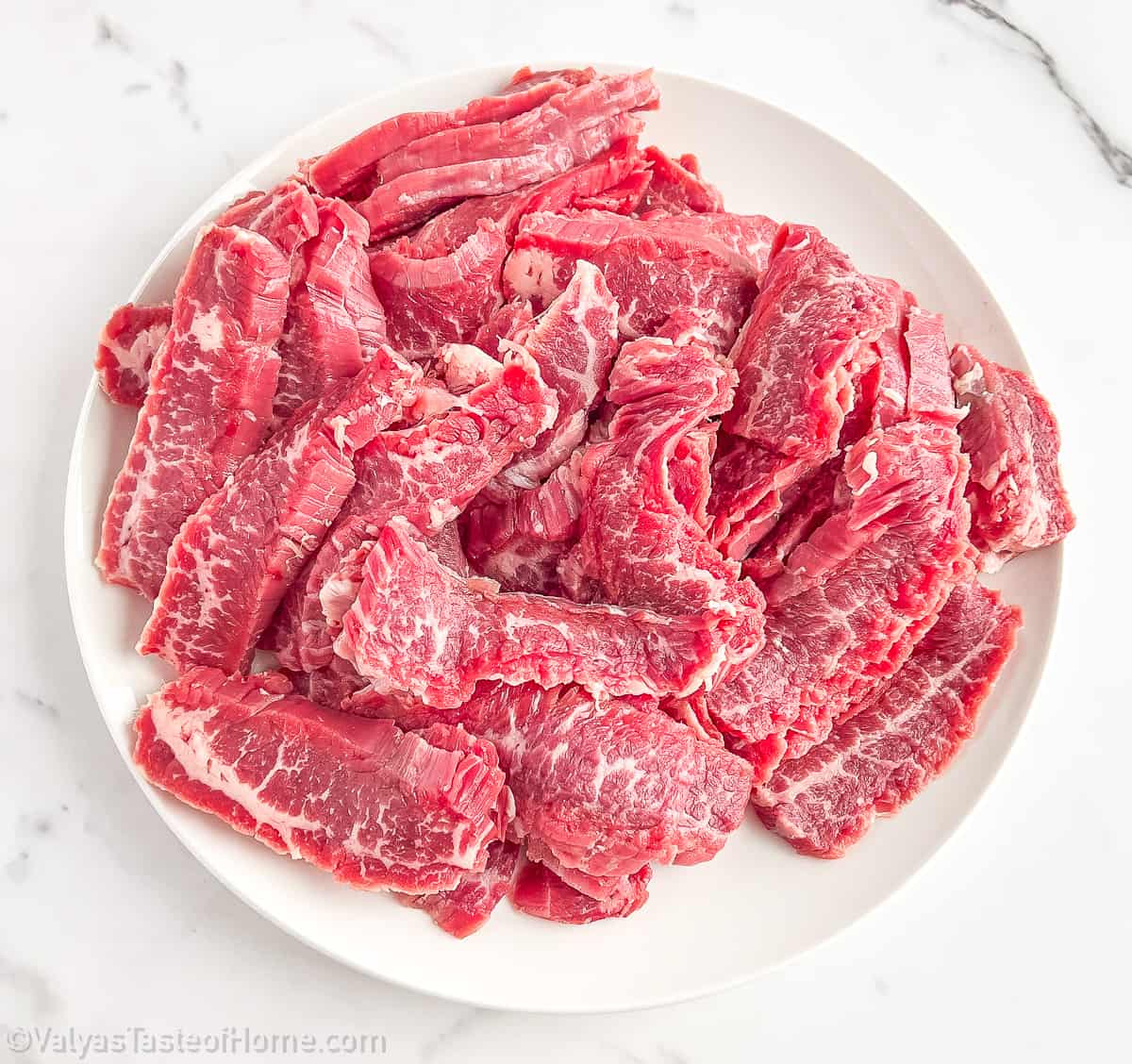 You need to carefully slice the sirloin steak thinly across the grain. Doing so will help ensure that your beef is tender and absorbs the flavor well.